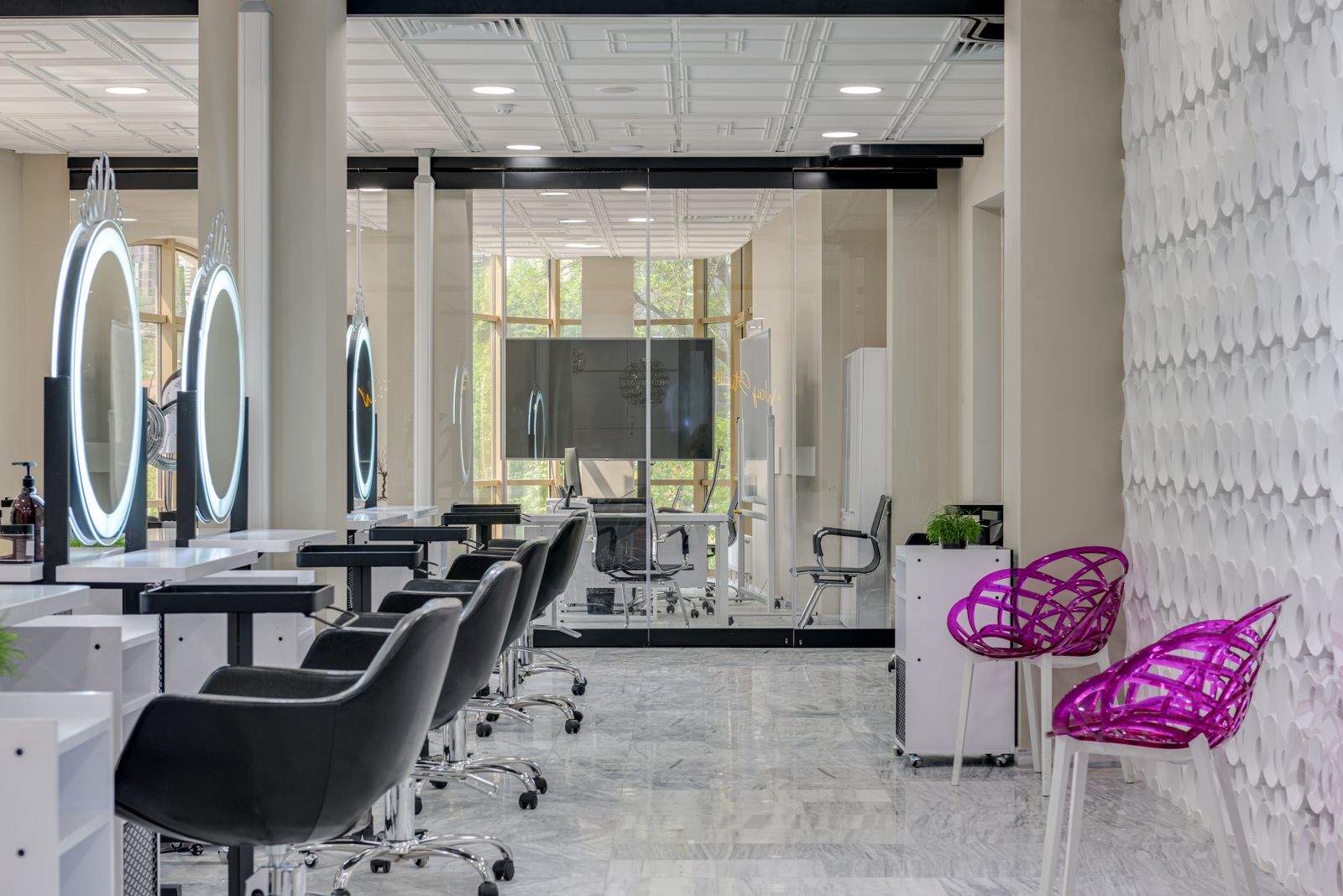 Chic salon space featuring sleek chairs, mirrors, and contemporary decor.